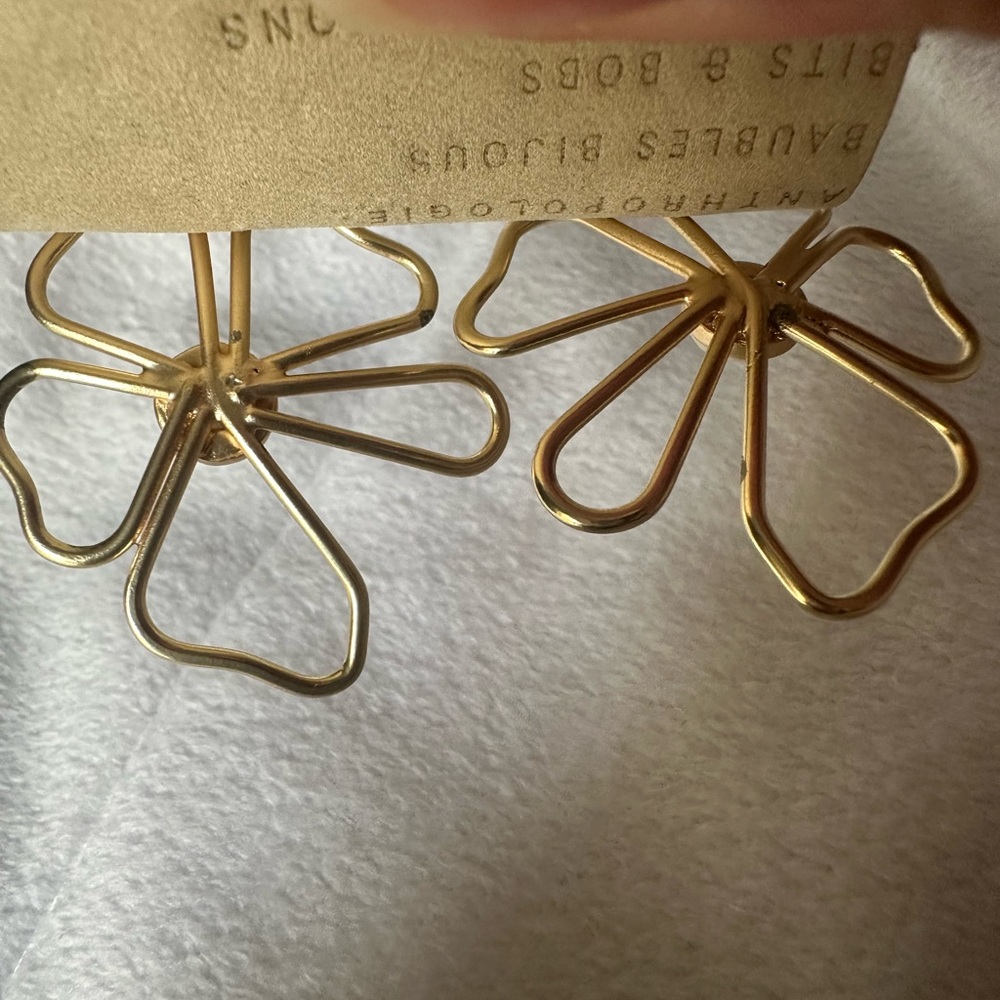 NWT- Anthropologie gold flower earrings with a white stone/pearl in the center.